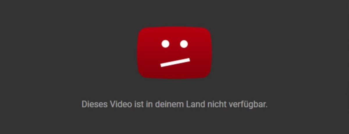 Eine Fehlermeldung, die einen unzufriedenen Emoji zeigt, Beschriftung: Dieses Video ist in deinem Land nicht verfügbar
