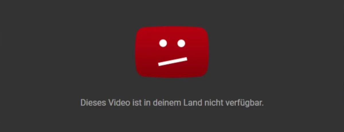 Eine Fehlermeldung, die einen unzufriedenen Emoji zeigt, Beschriftung: Dieses Video ist in deinem Land nicht verfügbar